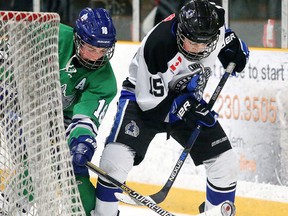 Jimmy Blanchard of the Sudbury Wolves battles for the puck with Skyler St. Pierre of the Nickel City Sons during the All-Ontario Peewee AAA Championship  in Sudbury, Ont. on Tuesday April 5, 2016. Gino Donato/Sudbury Star/Postmedia Network