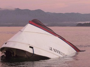 The bow of the Leviathan II, a whale-watching boat owned by Jamie's Whaling Station, is seen near Vargas Island Tuesday, October 27, 2015 as it waits to be towed into Tofino, B.C., for inspection. Six people died when the vessel capsized. THE CANADIAN PRESS/Chad Hipolito