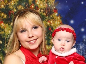 Jessica Bondar, holding baby sister Emma in this handout photo,  was critically ill in 2009 and a bank account accepting donations in support of her treatment was opened by an aunt.