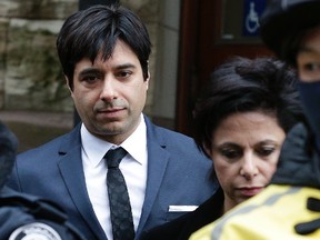 Jian Ghomeshi leaves Old City Hall after being found not guilty of sexual assault on March 24. (Craig Robertson/Toronto Sun/Postmedia Network)