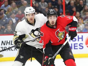 Mika Zibanejad of the Senators battles Ben Lovejoy of the Pittsburgh Penguins during the first period at the Canadian Tire Centre. (Jean Levac, Postmedia Network)