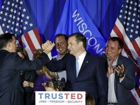U.S. Republican presidential candidate Ted Cruz (2nd R) celebrates with Wisconsin Governor Scott Walker (2nd L) during Wisconsin primary night rally at the American Serb Banquet Hall in Milwaukee on April 5, 2016. REUTERS/Kamil Krzaczynski