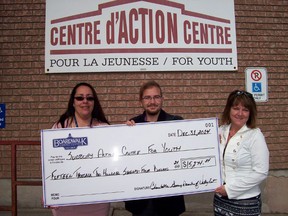 Catherine Savorie and Vincelt Bol of the Sudbury Action Centre for the Youth are presented with a cheque from Nathalie Dube, charity co-ordinator of Boardwalk Gaming Val Caron. The donation was for more than $15,000. Supplied photo