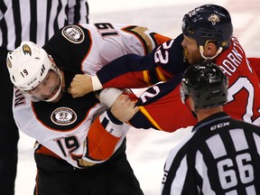 Florida Panthers right wing Shawn Thornton fights Anaheim Ducks left wing Patrick Maroon as linesman Darren Gibbs looks on in the second period at BB&T Center. (Robert Mayer/USA TODAY Sports)