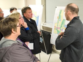 Residents congregate around placards outlining the changes MHBC have suggested for the township’s Official Plan. (Darryl Coote)