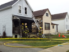 Firefighters in Petrolia responded to a house fire on Queen Street Wednesday morning. A woman who was an occupant of the house was rush to hospital and then tranferred to a London hospital in serious condition. (Brent Boles, Postmedia Network)