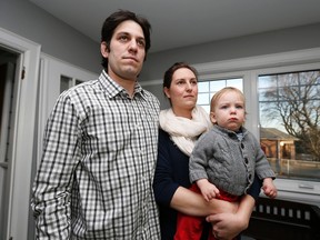 Jamie Gillman with wife Kailee Novikoff and son Cole, 15 months. He and his father were charged after a struggle with TTC security on Jan 29, 2015, following a Leafs game. The video went viral online. File pic from April 1, 2015. (Michael Peake/Toronto Sun/Postmedia Network)