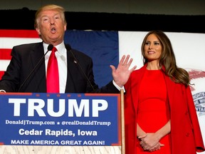 Republican presidential candidate Donald Trump, accompanied by his wife Melania, speaks during a campaign event in Cedar Rapids, Iowa, in this file picture from Feb. 1. Trump's support with women is plummeting. (AP Photo/Mary Altaffer, File)