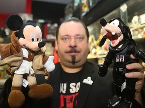 Michael Paille, owner of Cobra Collectibles, displays some of his Star Wars merchandise in his store last year. Paille was able to reunite a customer last week with a toy they had lost years earlier. (BRIAN DONOGH/WINNIPEG SUN FILE PHOTO)