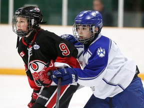 Sudbury Wolves defenceman Carter Benson keeps in close check with    Owen Rainey  of the  Brantford 99ers during theAll-Ontario Peewee AAA Championship  in Sudbury, Ont. on Wednesday April 6, 2016. Gino Donato/Sudbury Star/Postmedia Network