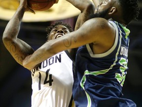 London Lightning?s Eric Kibi draws a foul on Niagara River Lions? Sauel Mudrow during their National Basketball League of Canada game at Budweiser Gardens on Wednesday night. The Lightning won 115-94. (MIKE HENSEN, The London Free Press)