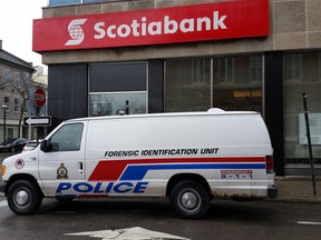 The Belleville police forensic unit is parked outside the Scotiabank in downtown Belleville.