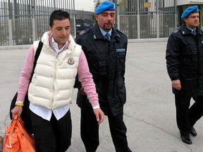 Giuseppe Salvatore Riina (L), the son of the most feared Sicilian Mafia boss, leaves a prison in Sulmona, central Italy, in a Feb. 28, 2008 file photo.  REUTERS/Claudio Lattanzio/Files