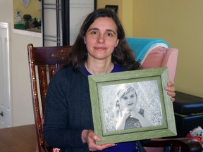 Woodstock mother Lalita Tamburri, holding a photo of her four-year-old daughter Jaya Kettniss, will be attending a rally on Parliament Hill at Queen's Park on April 14 to protest the possible closure of Robarts School for the Deaf. (HEATHER RIVERS, Sentinel-Review)