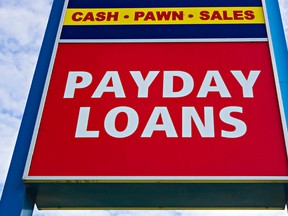 A sign advertising payday loans is seen in Edmonton, Alta., in this Oct. 7, 2015 file photo. (Codie McLachlan/Edmonton Sun/Postmedia Network)