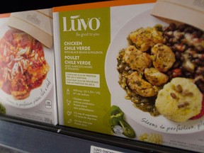 Luvo frozen dinners are pictured in a freezer at a Loblaws in Ottawa on Wednesday, April 6, 2016. Two Canadian business leaders want the country's food industry to use more transparent labels so Canadians know just how much nutrionally sparse food they're eating. (THE CANADIAN PRESS/Sean Kilpatrick)