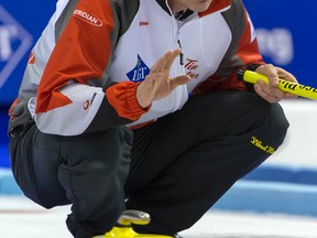 Canada's skip Kevin Koe competes during a round-robin match against Sweden at the world men's curling championship in Basel, Switzerland, on Wednesday, April 6, 2016. (Georgios Kefalas/Keystone via AP)