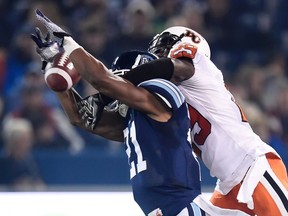 Toronto Argonauts’ Vidal Hazelton, left, attempts to catch a pass as B.C. Lions’ Steven Clarke interferes during CFL action in Toronto on Friday, Oct. 30, 2015. (THE CANADIAN PRESS/Frank Gunn)