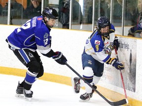 Nickel City Sons Joshua Kavanagh and Whitby Wildcats Nicolas Carvalho  battle for the puck during the  All-Ontario Peewee AAA Championship in Sudbury, Ont. on Thursday April 7, 2016. Gino Donato/Sudbury Star/Postmedia Network