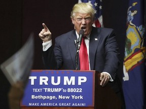 U.S. Republican presidential candidate Donald Trump speaks on stage during campaign event at Grumman Studios in Bethpage, New York April 6, 2016 REUTERS/Carlo Allegri