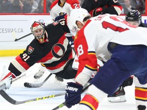 Goalie Craig Anderson of the Ottawa Senators follows the puck as Reilly Smith of the Florida Panthers tries to get a shot off during NHL action at the Canadian Tire Centre in Ottawa Thursday, April 7, 2016. (Jean Levac/Postmedia Network)