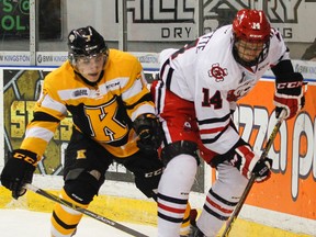 Kingston Frontenacs defenceman Nathan Billitier battles with Niagara IceDogs forward Christopher Paquette for the puck behind the Frontenacs net during Game 1 of an Ontario Hockey League Eastern Conference semifinal series at the Rogers K-Rock Centre on Thursday night. (Julia McKay/The Whig-Standard)