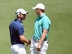 Masters leader Jordan Spieth (right) shares a laugh with playing partner Paul Casey during Round 1 in Augusta yesterday. (AFP)