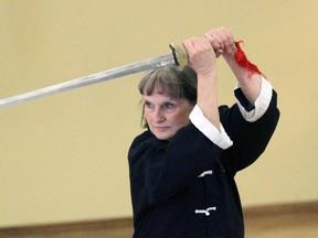 Carroll Whitelaw of North Star Tai Chi demonstrates the Chinese sword at an open house at the Strangway Community Centre on Saturday April 2, 2016 in Sarnia, Ont. Whitelaw is training to become a master. Terry Bridge/Sarnia Observer/Postmedia Network