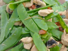 Peas are delicious, whether picked fresh from your backyard garden, or used in cooking such as this stir-fry meal that included snow peas and chicken. John DeGroot/Special to Postmedia