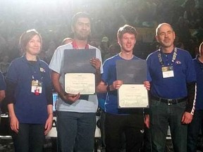 Cameron Douglas, second from right, a Grade 11 student at St. Joe's is the recipient of the Dean's List Finalist Award at the FIRST Robotics competition at Waterloo University.