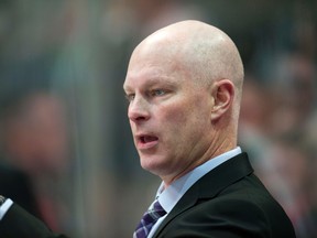 New Jersey Devils head coach John Hynes  motions to his team during the third period against the Dallas Stars at the American Airlines Center. (Jerome Miron/USA TODAY Sports)