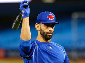 Blue Jays Jose Bautista gets ready to flip his bat to the ground as players work out before the home opener at Rogers Centre in Toronto on April 7, 2016. (Michael Peake/Toronto Sun/Postmedia Network)