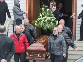 The casket of Jean Lapierre's father Raymond is carried out of church following funeral services for former Liberal cabinet minister Jean Lapierre and five of his relatives Friday, April 8, 2016 in Bassin, Que. THE CANADIAN PRESS/Paul Chiasson