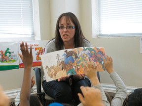 A grade two teacher at Jackson Heights School in Edmonton, reads to her class. LARRY WONG/Postmedia Network