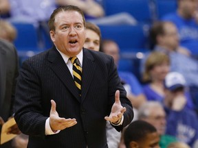 In this March 16, 2013, file photo, then-Southern Miss head coach Donnie Tyndall gestures during the championship game in the Conference USA men's NCAA college basketball tournament in Tulsa, Okla. (AP Photo/Sue Ogrocki, File)