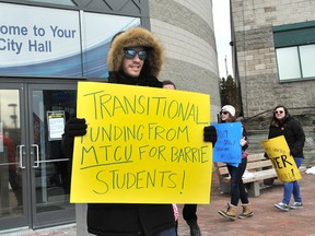 Laurentian University students from the Barrie campus protested outside Premier Kathleen Wynne's press conference at Barrie City Hall in this file photo.IAN MCINROY/BARRIE EXAMINER/POSTMEDIA