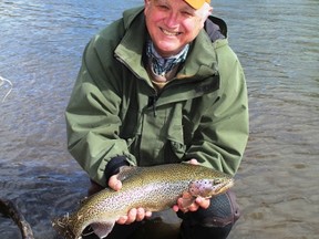 Emmerson Dober with a 20 inch Crowsnest River rainbow trout.Neil Waugh/Postmedia Network