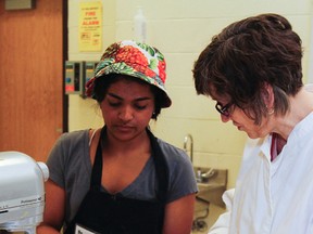 Baking competitor Sonal Gupta gets some dough advice from baking judge Joanna Malan during the bakery event of the Limestone Skills Competition, held at Bayridge Secondary School in Kingston, Ont. on Wednesday April 6, 2016. Julia McKay/The Whig-Standard/Postmedia Network