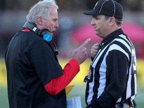 Stampeders coach John Hufnagel has words for the referee against the Lions during first half CFL Western Semifinal action at McMahon stadium in Calgary on Nov. 15, 2015. (Darren Makowichuk/Postmedia Network)