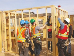 Habitat for Humanity Edmonton volunteers help build a new home. One of the non-profit organization’s condo units in Stony Plain is now available for a new family. - Photo supplied