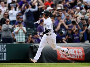 Colorado Rockies shortstop Trevor Story rounds the bases following his two run home run in the fourth inning against the San Diego Padres at Coors Field. (Ron Chenoy/USA TODAY Sports)