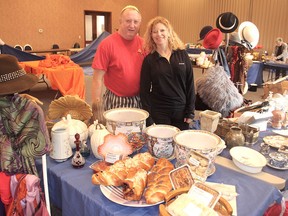 Chef Ian Sarfin, left, and event chair Hilary Tenenhouse, at the Beth Israel synagogue on Friday, stand in the midst of some of the wares that will go on sale during a food and gift market on Sunday. (Michael Lea/The Whig-Standard)