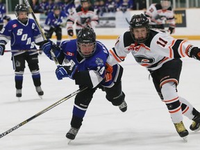 Alexandre Antoine, left, of the Nickel City Sons, and Jack Budd, of the Don Mills Flyers, battle for the puck during action at the 2016 AAA Peewee All Ontario Championship gold medal game at the Gerry McCrory Countryside Sports Complex on Friday evening. John Lappa/The Sudbury Star/Postmedia Network