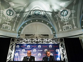 Edmonton Oilers president of hockey operations and GM Peter Chiarelli, left, introduces new head coach Todd McLellan at the Fairmont Hotel Macdonald last May. (File)