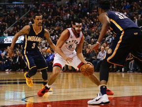 Raptors’ Cory Joseph, wearing the protective mask, goes to the key against the Pacers’ Myles Turner at the ACC last night. (Jack Boland/Toronto Sun)