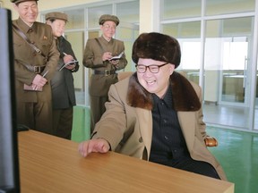 North Korea leader Kim Jong Un watches the test of a new engine for an intercontinental ballistic missile (ICBM) at a test site at Sohae Space Center in Cholsan County, North Pyongan province in North Korea in this undated photo released by North Korea's Korean Central News Agency (KCNA) on April 9, 2016. (REUTERS/KCNA)