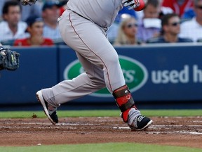 Red Sox third baseman Pablo Sandoval busted his belt swinging on a pitch from the Blue Jays' R.A. Dickey on Saturday in Toronto. (Mike Zarrilli/Getty Images/AFP/Files)