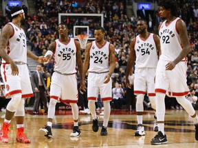 Raptors' James Johnson (3) congratulates teammate Delon Wright (55) during a time out in the third quarter against the Pacers in Toronto on Friday, April 8, 2016. (Jack Boland/Toronto Sun)