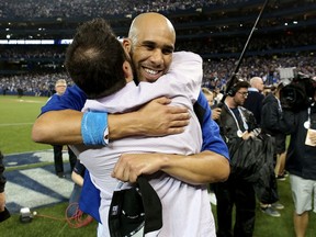 General manager Alex Anthopoulos and David Price of the Toronto Blue Jays celebrate winning the American League Division Series at Rogers Centre in Toronto on Oct. 14, 2015. (Tom Szczerbowski/Getty Images/AFP)