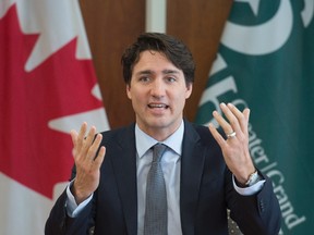 Prime Minister Justin Trudeau gestures as he delivers opening remarks at the start of a meeting with local politicians at city hall in Sudbury, Ont., Thursday, April 7, 2016. THE CANADIAN PRESS/Adrian Wyld